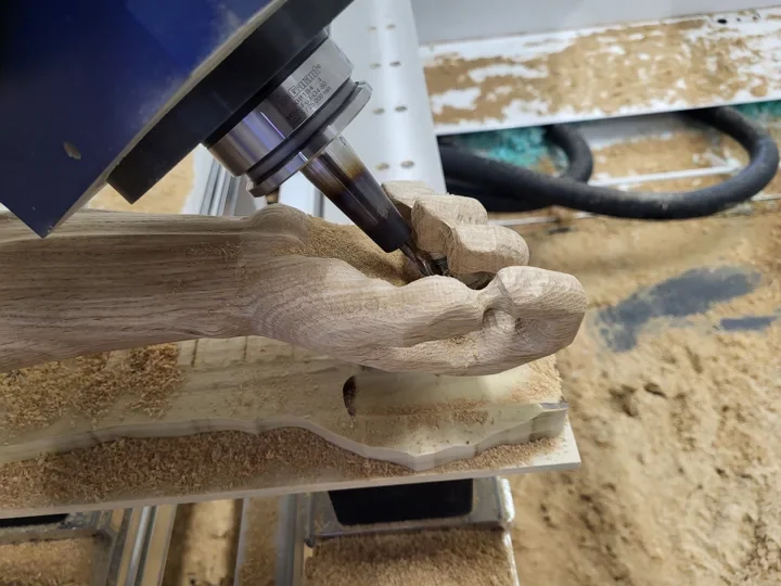 Detail machining of the feet of the figure of Christ