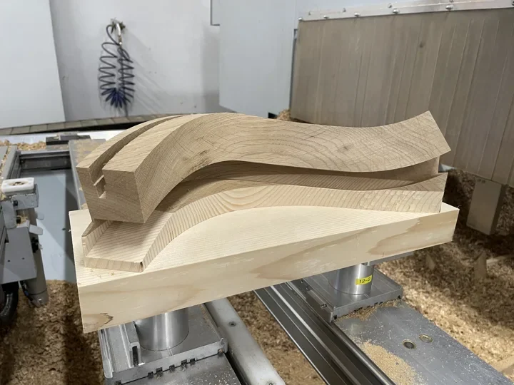 Curved wooden component on the machine table